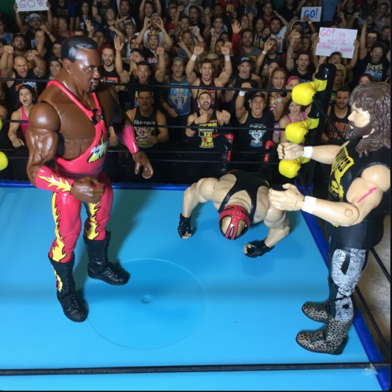 WWE Elite Series action figure of Big Van Vader off his feet after receiving a left hook.