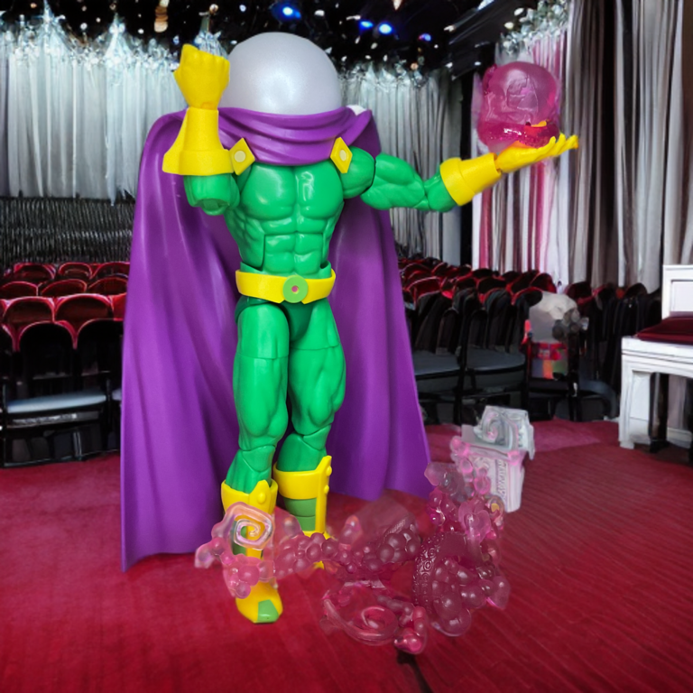 Nahaufnahme der 2025 Marvel Legends Mysterio Retro-Figur im leuchtend lindgrünen Anzug mit gelb-goldenen Handschuhen, die mit durchsichtigen roten Energieschocks an den Händen posiert.