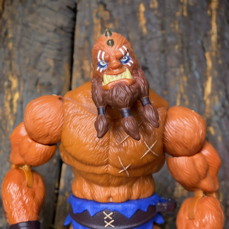 A close-up of Beat Man illustrating is haggard and scarred up body.