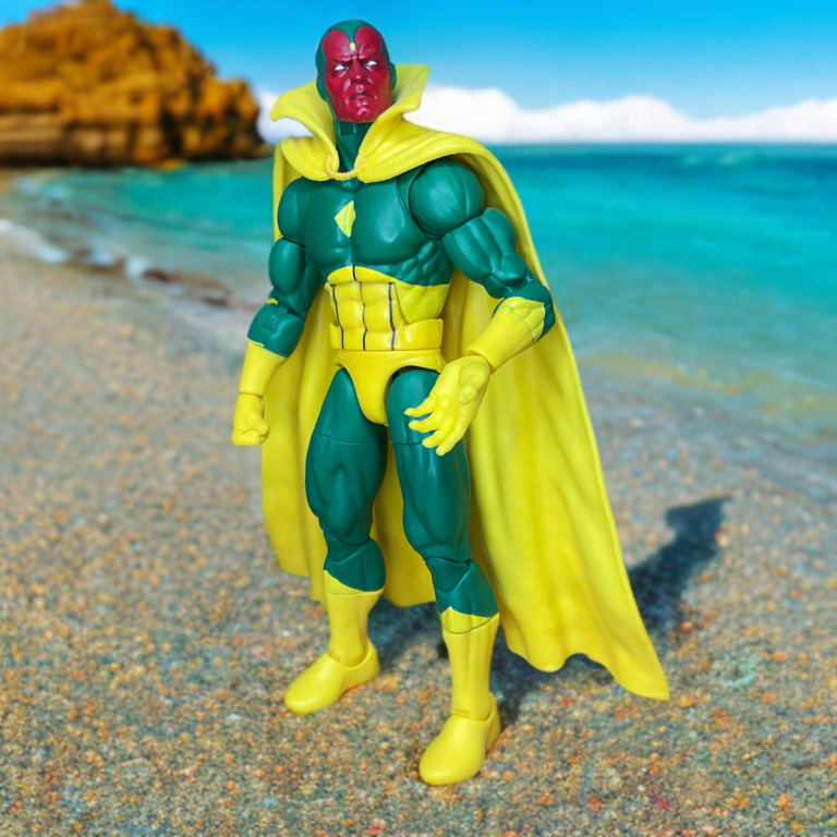 The Vision, not white yet, appearing on the coast of a beach.