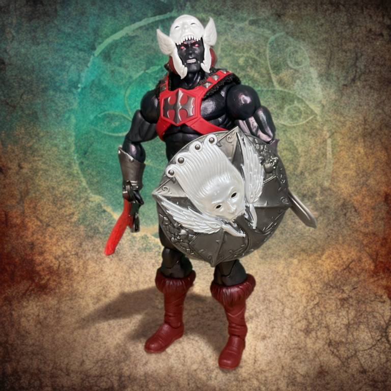 Esta imagem mostra os cotovelos e joelhos com articulação dupla no espectral He-Man Anti-Eternia, destacando os detalhes da bota cibernética medieval.