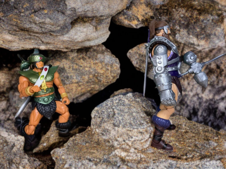 Jagged, rocky fantasy landscape representing the Shattered Plains battlefield where Tri-Klops stalks Fisto.