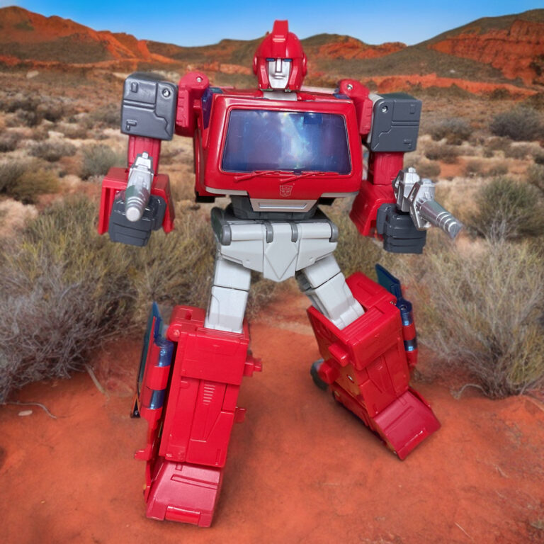 Studio Series 86-17 Ironhide action figure in his classic red Nissan Cherry Vanette vehicle mode.