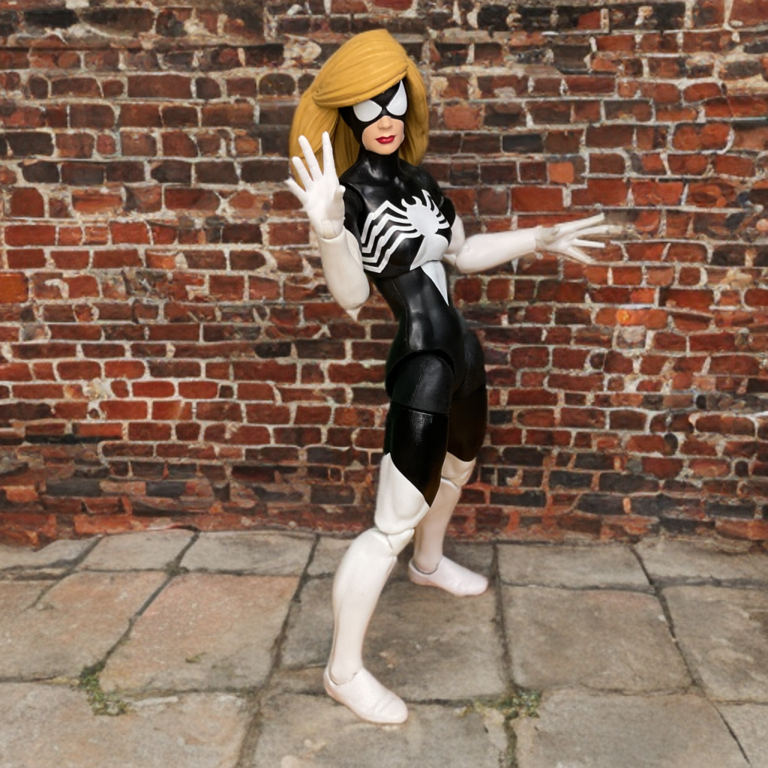 An action pose of Spider Woman figure, with with her black costume prominent.