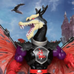 Close-up of MOTU Origins Turtles of Grayskull Ninjor head sculpt featuring the black ninja hood and demonic red eyes.