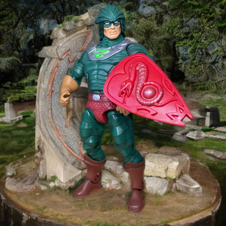 MOTU Classics King Hiss Actionfigur mit abnehmbarer Rüstung, die den inneren Schlangenkörper offenbart, grünen Schuppen und goldenen Akzenten.