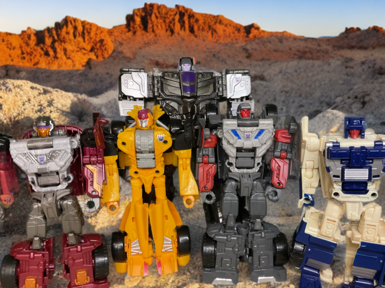 G1 Stunticons team in desert highway scene, vehicles posed including Motormaster semi-truck and sports cars.