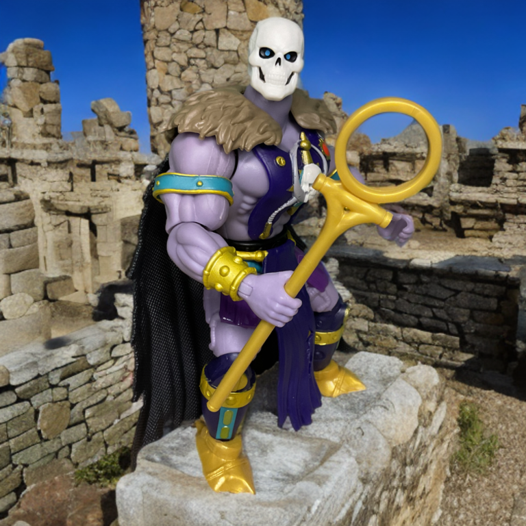 MOTU Origins Great Black Wizard action figure among castle ruins.