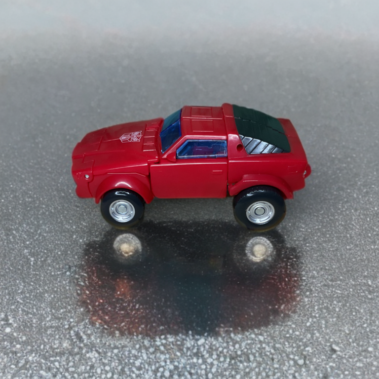 Transformers Studio Series Windcharger in rotem Sportwagen-Fahrzeugmodus, schnittiges Profil im Pontiac Firebird-Stil.