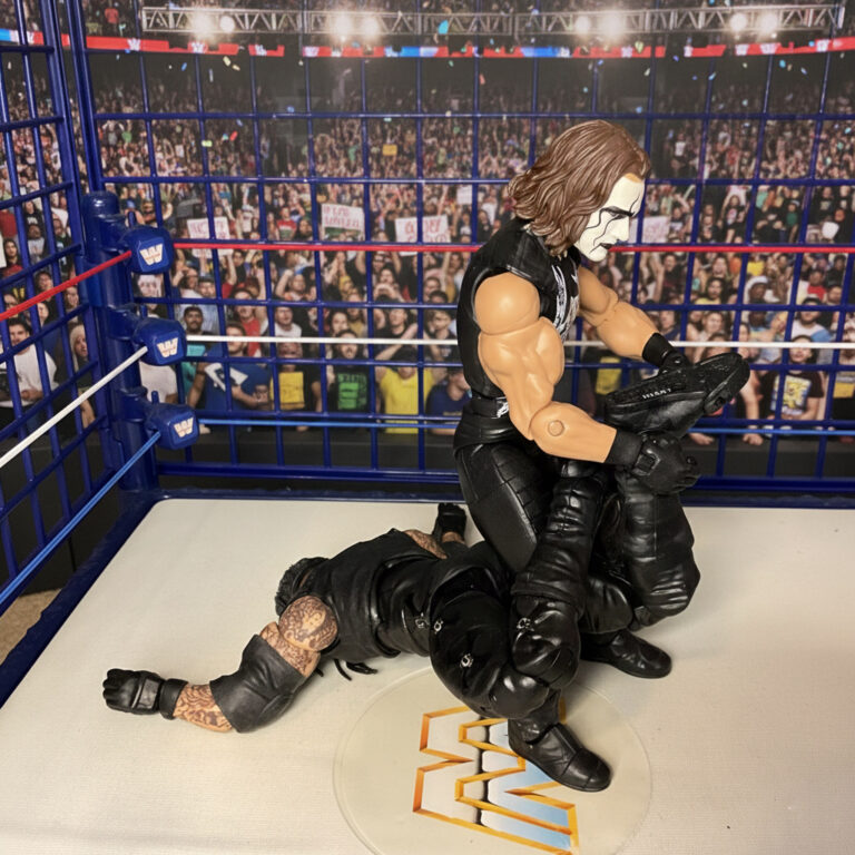 Sting nimmt den Undertaker in den Scorpion Death Lock.