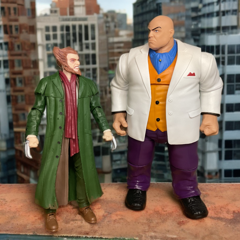The owl with the kingpin of crime standing on a rooftop in the city.