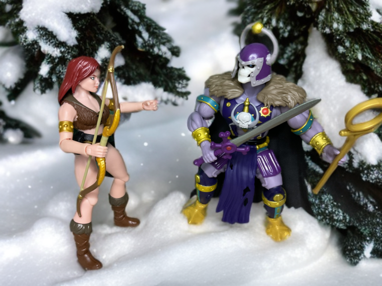 Sharella faces the Great Black Wizard in a snowy scene.