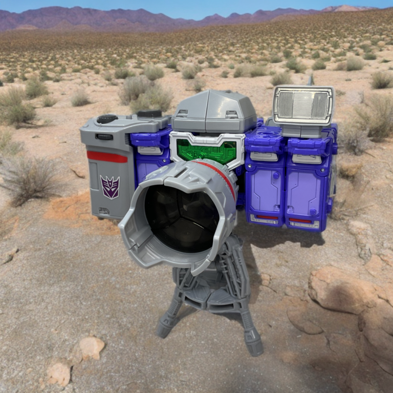 Dramatic Capture Series Reflector (Spectro, Spyglass, Viewfinder) combined into Decepticon camera mode with tripod stand spying on Autobots in the desert.