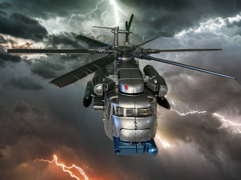 Zeta Toys Whirlblade in helicopter mode, featuring white-gray body, black rotors, blue accents, and undercarriage details on a black platform.