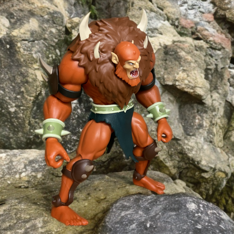 Detailed paintwork on Beast Man figure showing orange fur gradients, armor shading, and textured sculpt.