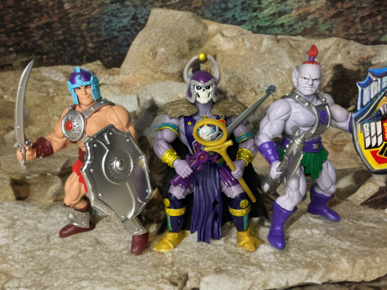 Photo de groupe des méchants de Legends of Dragonore comprenant le sorcier Black Wizard, Baltard, créateur de chaos inarrêtable, et Magnon, guerrier brutal à cornes massives, dans un cadre mystique sombre.