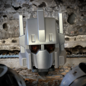 Robot combiner alternate head piece with battery compartment visible, designed for glowing eyes and sound functions.