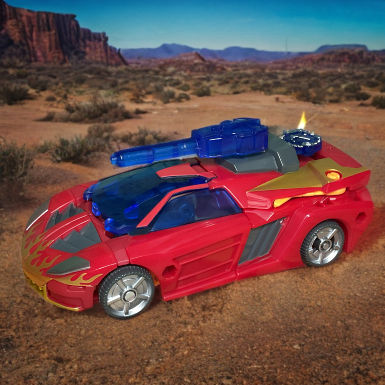Transformers Excellion vehicle mode red sports car with flame graphics, blue translucent cockpit, and roof-mounted blue blaster.