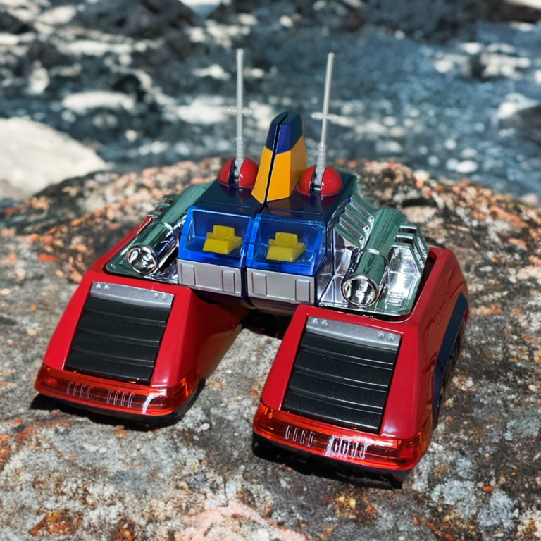 Voltes V's Volt Frigate green/yellow submarine-like craft, sleek hull with red accents, periscope and fins extended, emphasizing speed and agility.