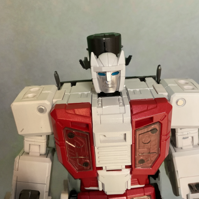 Close-up detail shot of Zeta Toys Airstrike Metallic Edition robot mode head and chest, metallic silver visor and premium blue paint applications.