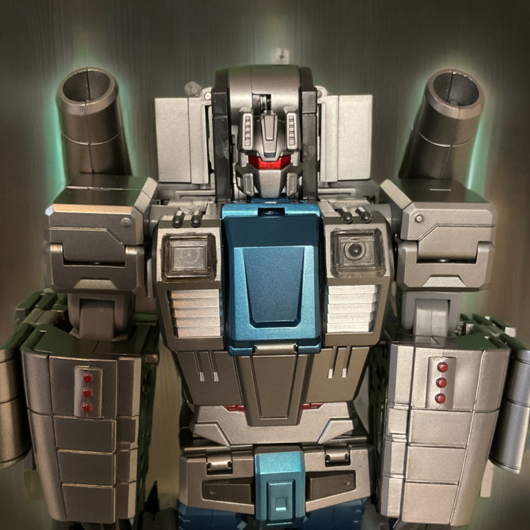 Close-up of Zeta Toys Whirlblade robot mode upper body, purple armor with teal central panel, red accents, and large cannon barrel visible.