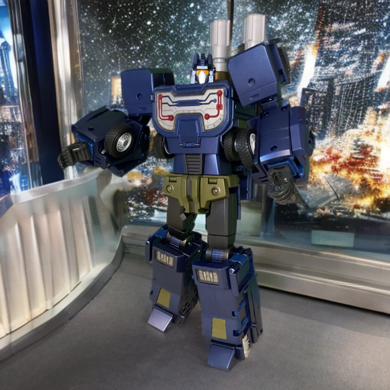 Zeta Toys Blitzkrieg robot mode in action pose, blue body with tan accents, dual large cannons on back, and rifle in hand on starry background.