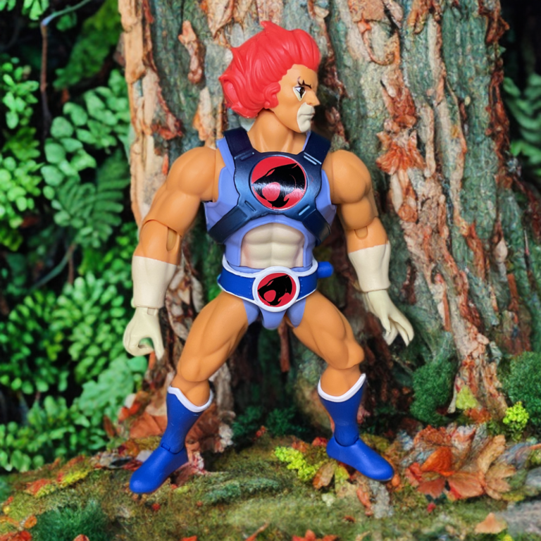 Vintage 1980s Thundercats Lion-O action figure standing in the forest, red outfit and mane, classic retro style in natural light.