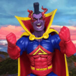 Gladiator (Kallark), leader of the Shi'ar Imperial Guard, standing confidently in blue and gold armored suit with red cape and stern expression against a crimson cloudy background.