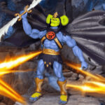 Skell-Ra in full empowered form from Masters of the Universe Origins x ThunderCats, blue muscular body with purple cape and skull face, featured on Fantasy Action Figures.