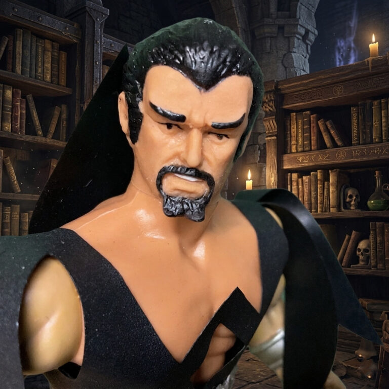 A tight close-up shot of the 1982 Remco Deimos action figure’s face, showing his human features and goatee.