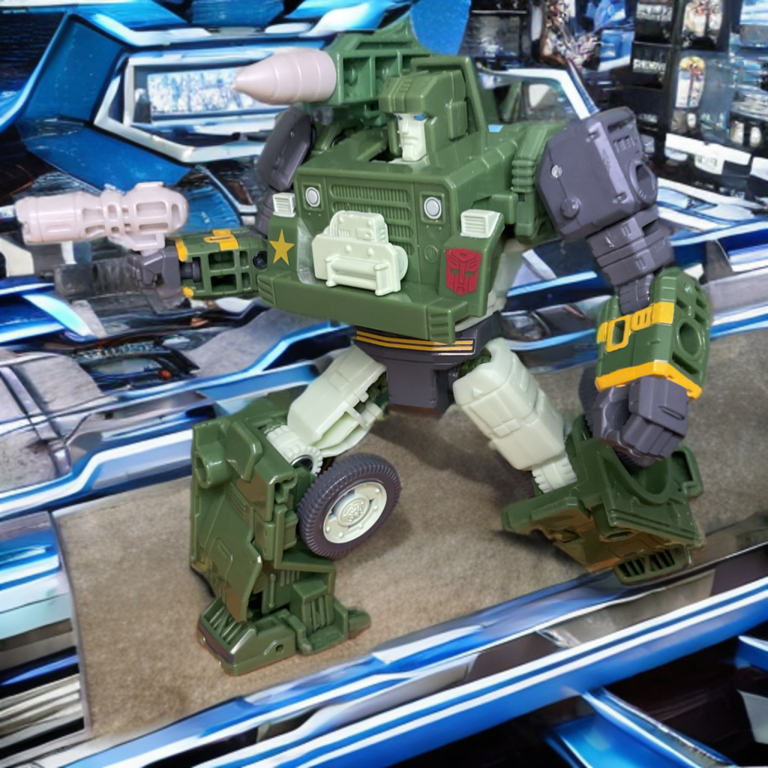 Studio Series Autobot Hound with blaster rifle in hand and shoulder cannon, simple yet iconic weapon setup.