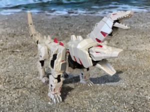 Unique Toys O-04 Siegfried twin-headed dragon mode as the Ordin torso core by the shore.
