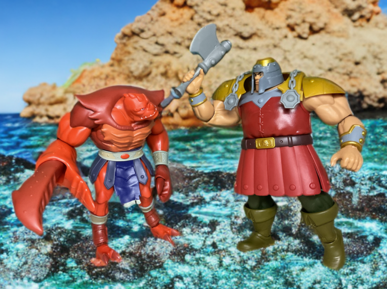 MOTU Origins 200x Ram Man squaring off against the Cartoon Collection Clawful in a battle pose by Fantasy Action Figures.
