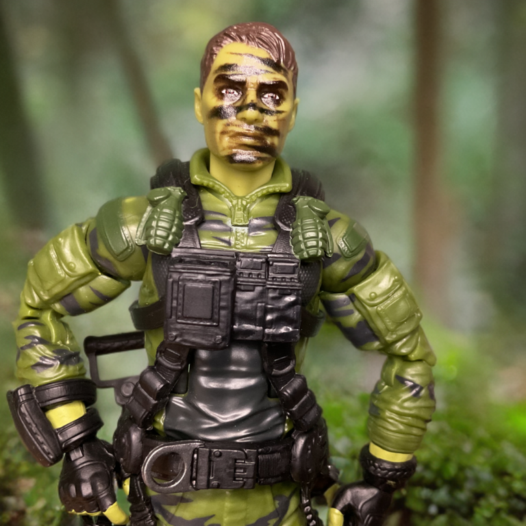 Close-up of G.I. Joe Classified Hit & Run face sculpt with camo paint and helmet details.