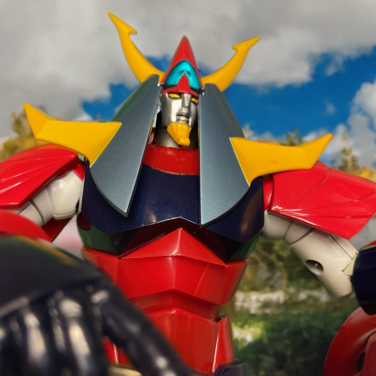 Raideen figure in a wide-legged shouting pose for the God Voice sonic ring attack.