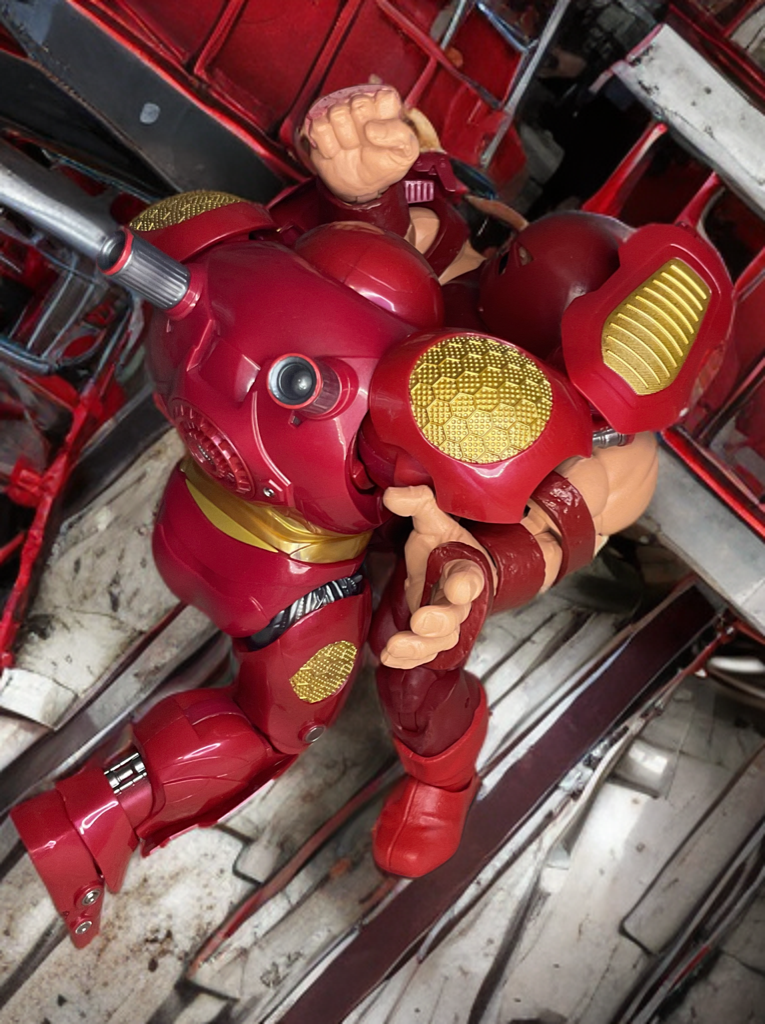 Juggernaut squeezing Hulkbuster in powerful grapple during intense smashmouth fight.