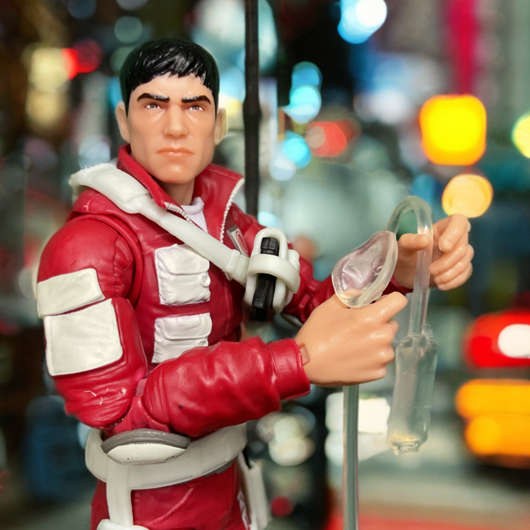 G.I. Joe Classified Lifeline figure posed with IV bag and oxygen mask accessories simulating emergency rescue.
