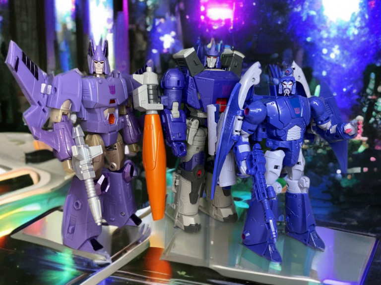 Studio Series action figures of Galvatron, Cyclonus, and Scourge posed menacingly as a group against a dynamic backdrop.