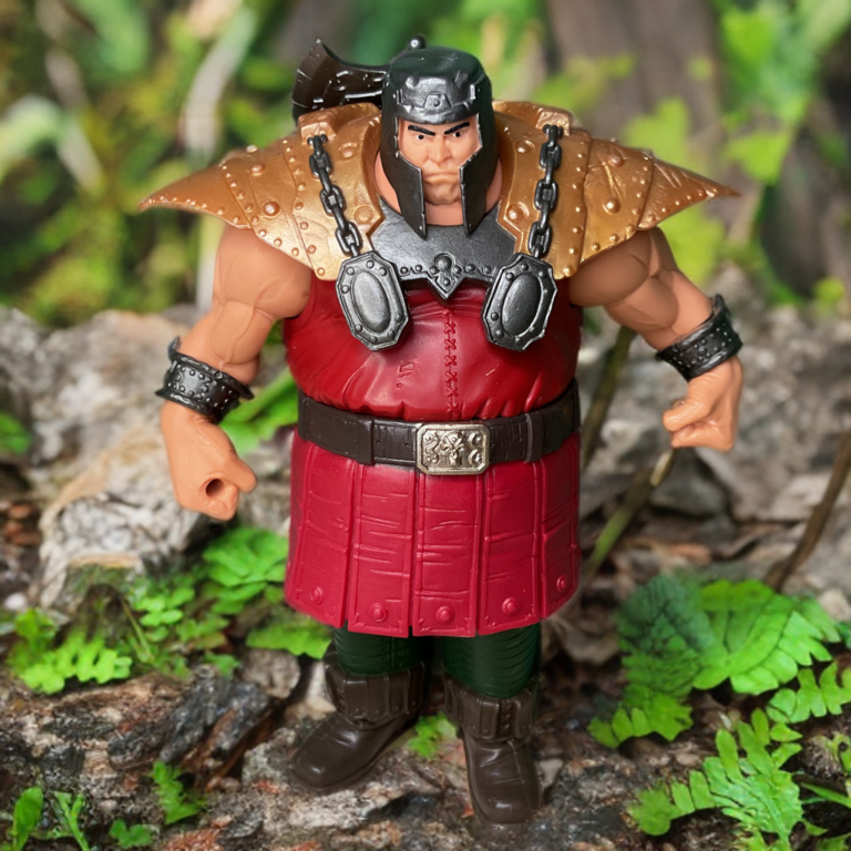 200x vintage Ram Man action figure from 2002 posed in an enchanted forest scene.