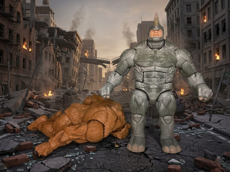 Marvel Legends Rhino action figure standing victoriously over a defeated Marvel Legends Grizzly figure lying on the ground, depicting an intense Spider-Man bruiser battle scene from Fantasy Action Figures.