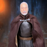A cinematic close-up of the Hasbro Star Wars Black Series Count Dooku action figure holding his curved-hilt lightsaber.