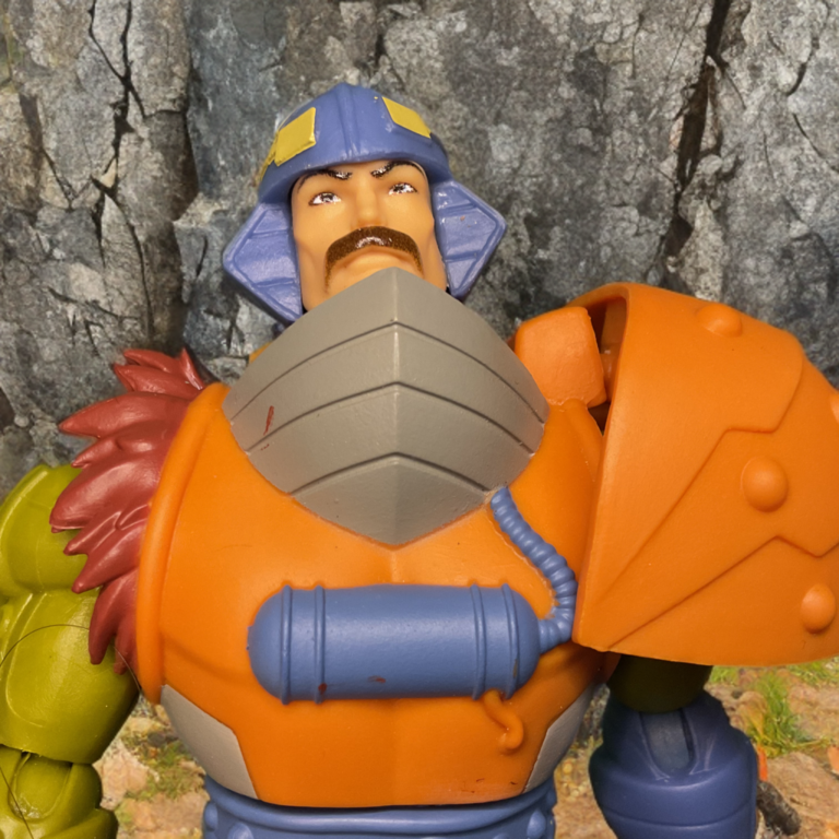 Head sculpt of MOTU Origins 200X Man-At-Arms featuring detailed facial expression and iconic mustache.