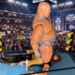 Action figures of Norman the Lunatic delivering a sit-down splash pin on Cactus Jack Manson during their 1990 WrestleWar match at the Greensboro Coliseum. Fantasy Action Figures.