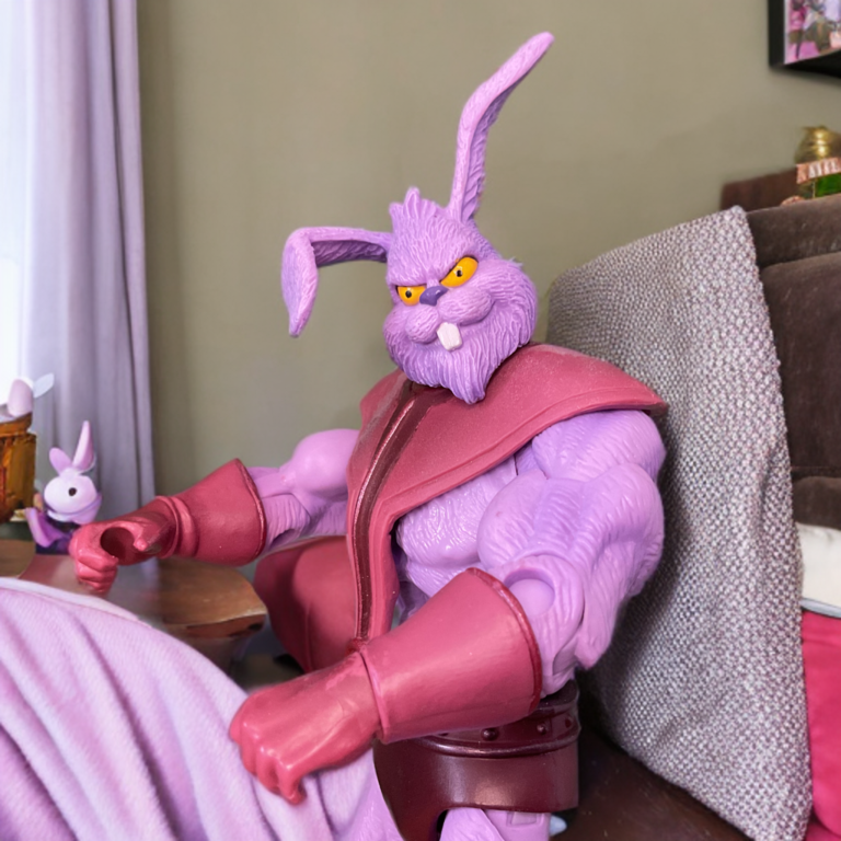 Plundor the pink rabbit villain getting out of bed in the morning, already plotting his takeover of Eternia. Fantasy Action Figures humorous scene.