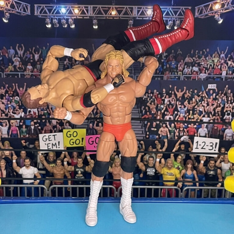 Lex Luger action figure executing the Torture Rack submission hold on Mean Mark.