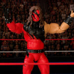 Fantasy Action Figures powerful solo shot of Kane celebrating victory with arms raised in the center of the ring.