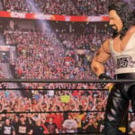 Kevin Nash standing dominantly over a fallen opponent in the wrestling ring, illustrating his pragmatic business-first approach versus old-school kayfabe protection.