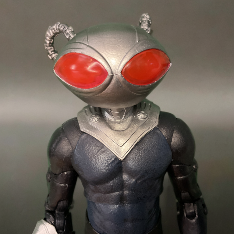 Close-up of Black Manta action figure’s signature oversized helmet and armored suit.
