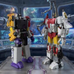DX9 Attila Menasor action figure locked in a dynamic battle stance against the Zeta Toys Superion combiner on a collector display shelf.