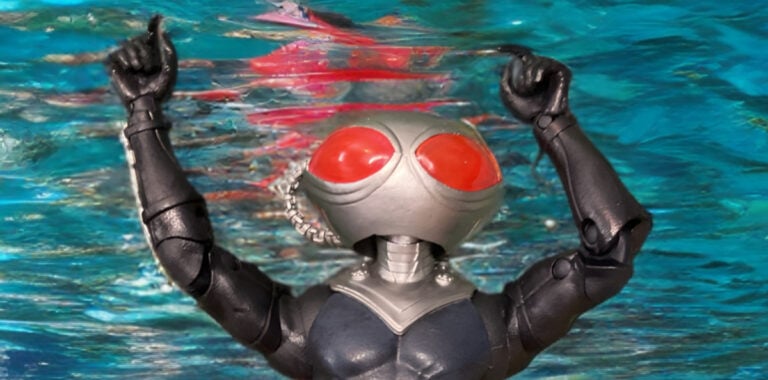 DC Multiverse Black Manta action figure from Aquaman and the Lost Kingdom, shown in a powerful dynamic pose on flight stand with jetpack flames, highlighting the detailed armored suit and helmet of Aquaman’s arch-nemesis.